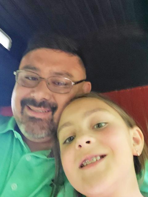 Adam Richards and his daughter taking a selfie.