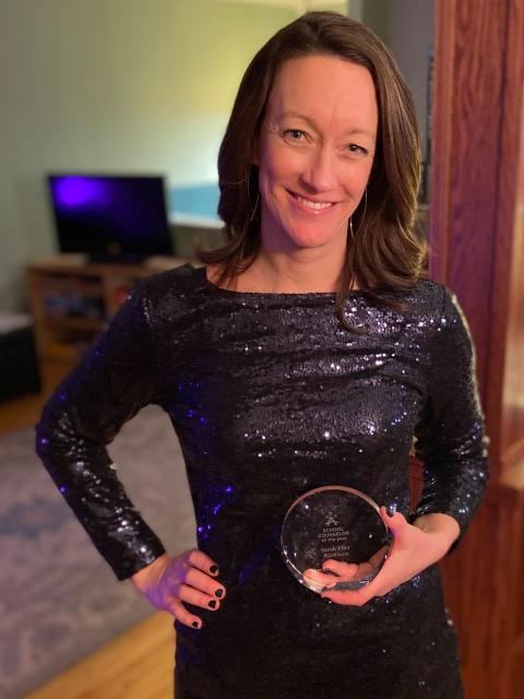 Flier celebrating her award at home