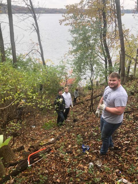 Students working on the Lake Menomonie lakeshore.