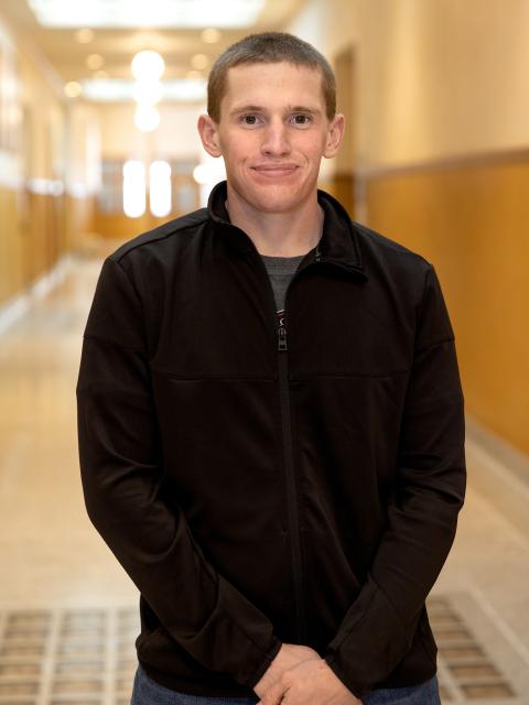 DJ Walker, a junior from Menomonie in the applied social science program, is presenting the results of his research at the annual Research in the Rotunda event March 9 at the Capitol in Madison.