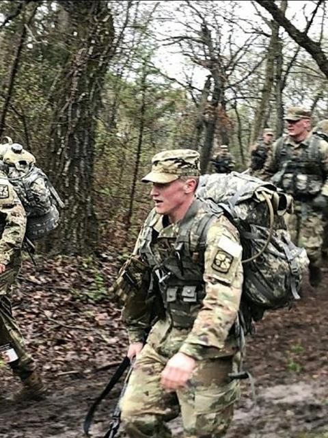 Walker, right, participates in a march during an Army ROTC event in Kansas. He is in UW-Stout’s ROTC program.