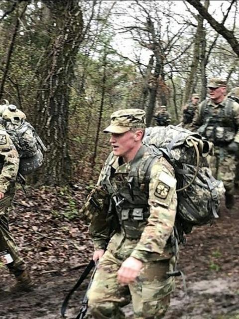 Walker, right, participates in a march during an Army ROTC event in Kansas. He is in UW-Stout’s ROTC program.