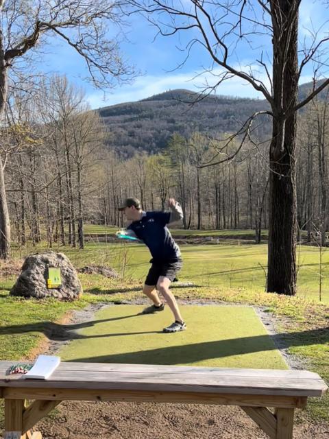 UW-Stout’s Kyle DeVries tees off on a hole during the national meet.