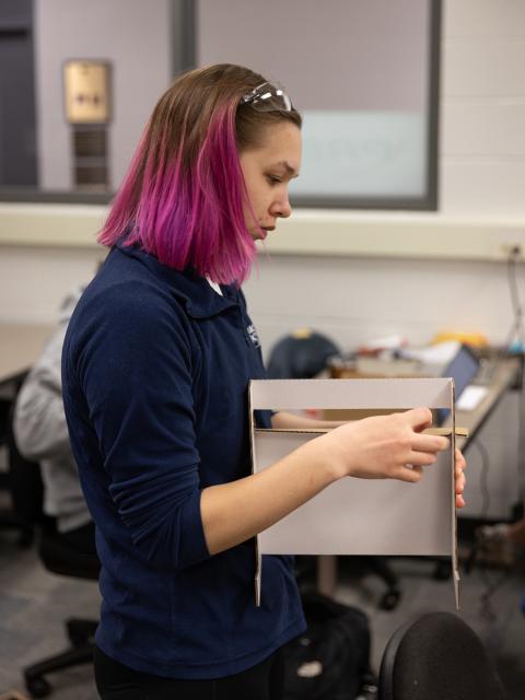 Packaging major Shannon Schultz works on a package for the Divine makeup line her team created for Revolution Beauty of London.