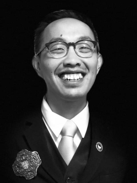 Black and white portrait of Ger smiling