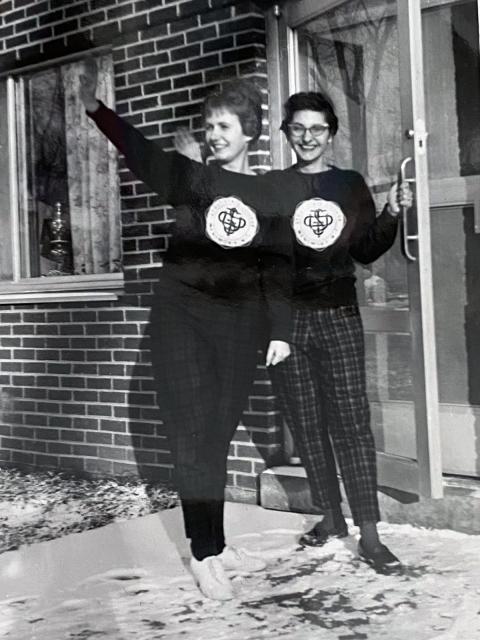 Sharon Hafeman Balius, right, and her roommate wave from the door of the new Bertha Tainter residence hall (now Jeter-Tainter-Callahan) on north campus in the late 1950s.