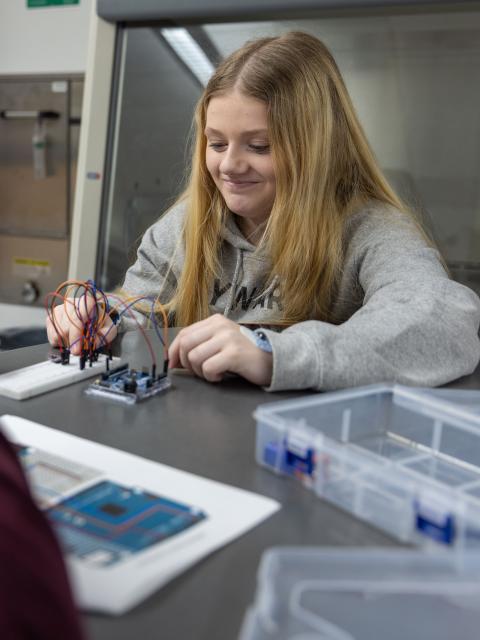 Upward Bound student in Stout science lab