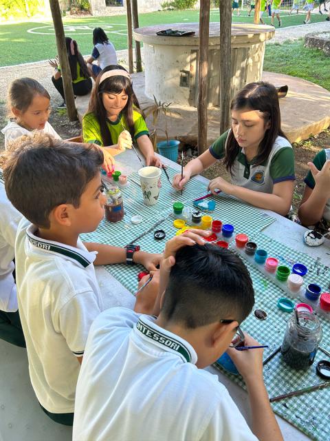 Montessori students painting