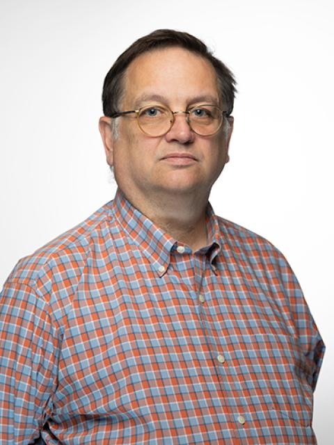 Portrait photo of Associate Professor Kevin MacDonald