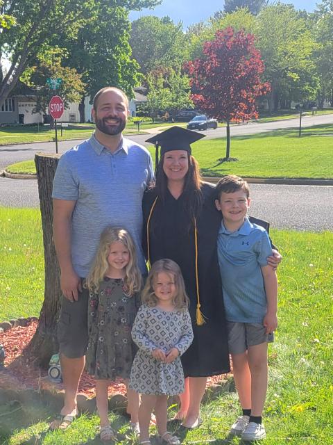 Family standing with graduate